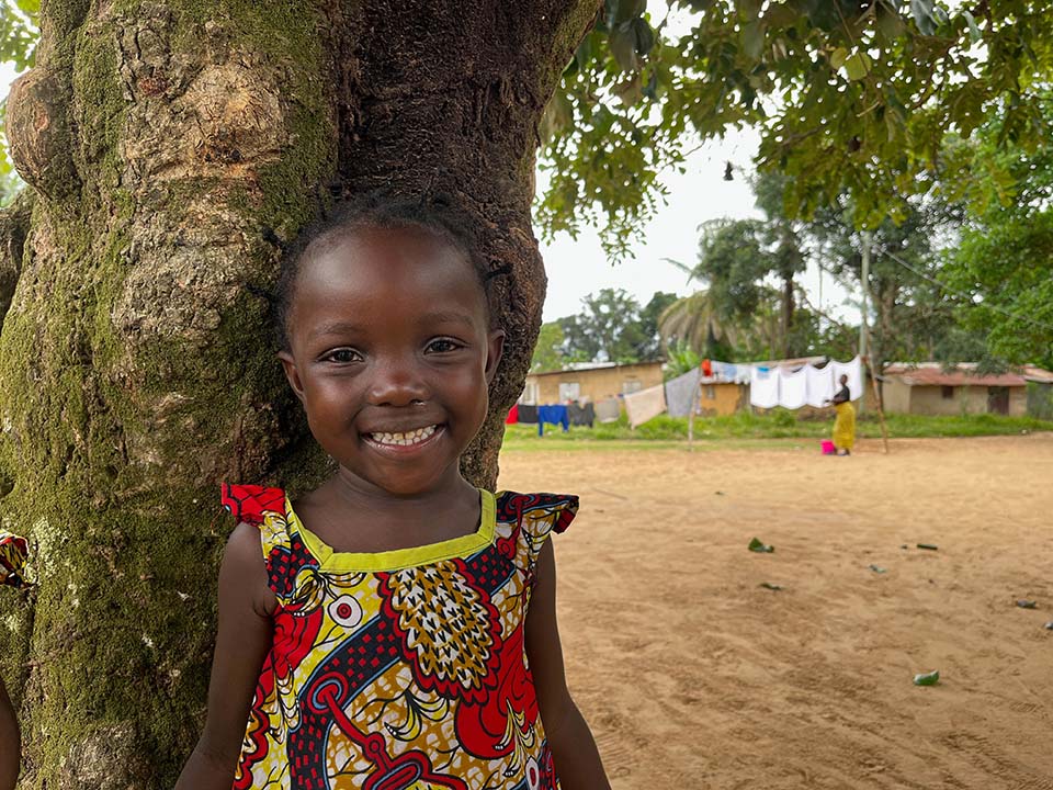 smiling child facing camera in Republic of Congo