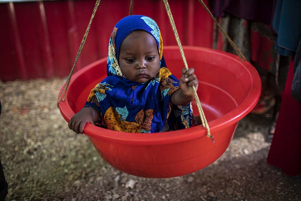 child weighed in Somalia clinic