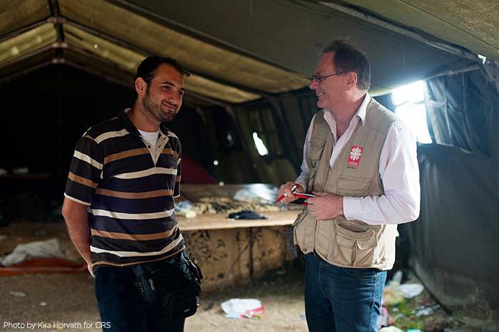 Syrian refugee Abraham Zahra fled enlistment into Bashar al-Assad's army. Like many Syrian refugees, he had fled to Europe in search of a better life. CRS is assisting the Syrian people in transit all through the region.