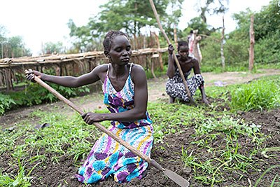 Farmers in the Tuktiop group get ready to transplant tree seedlings. Members have learned that the young plants require time in the nursery's soil before they're ready to sell. Photo by Sara A. Fajardo/CRS