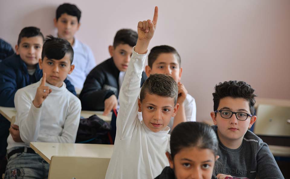 student in Iraq classroom