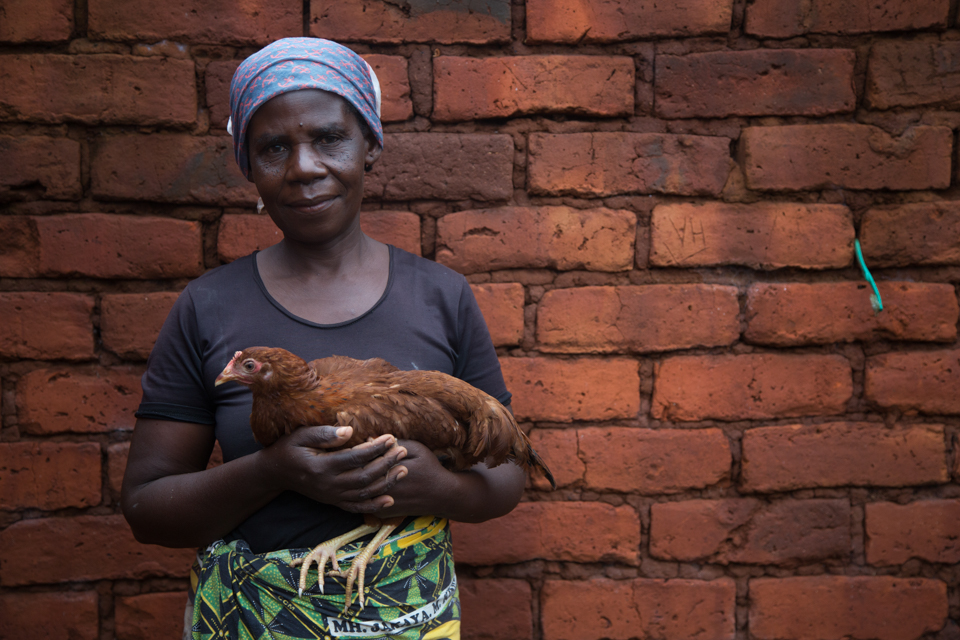 woman with chicken in Tanzania