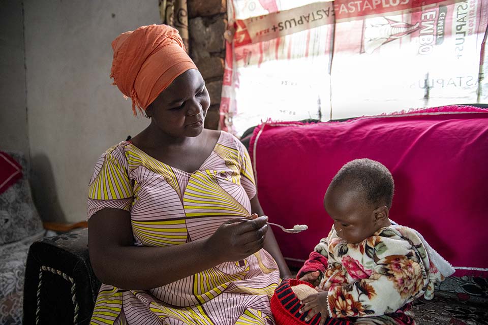 Tanzanian mother feeding her child