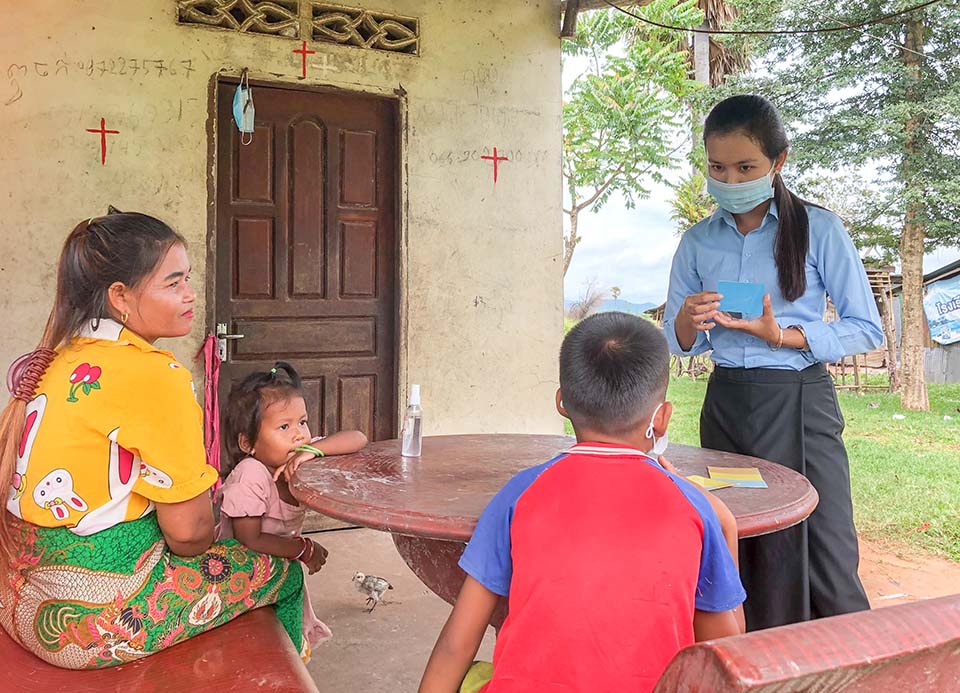 teacher visits student home in Cambodia