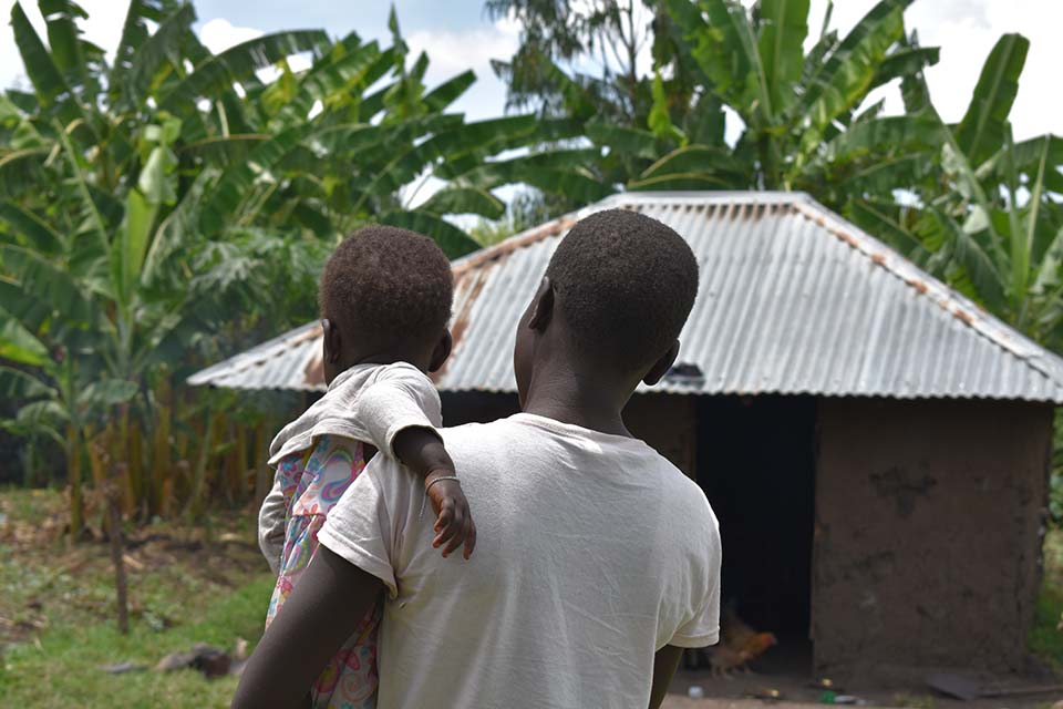 teen mother holding child in Kenya