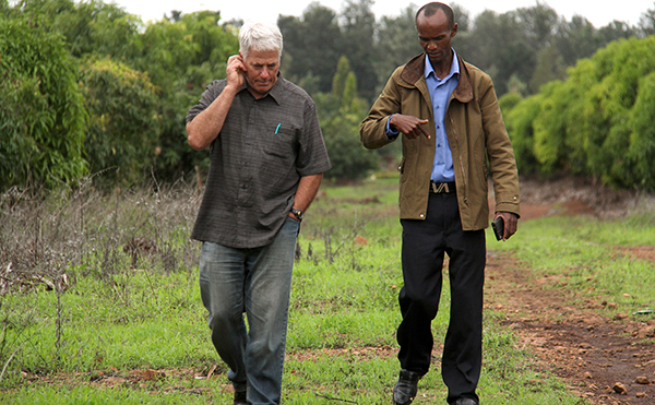 discussing business in a Kenya field