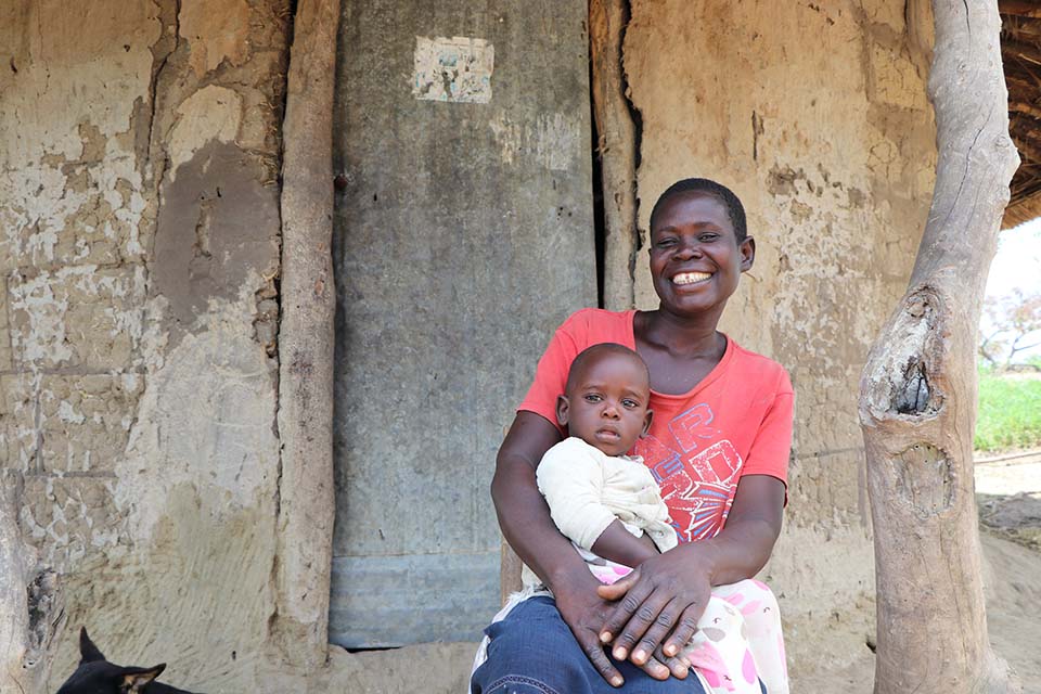 mother holds her child in Uganda