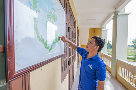 Photo by Lisa Murray for CRS As a result of community engagement, Thuong and his TSG have produced a local hazard map to keep villagers safe from climate threats.