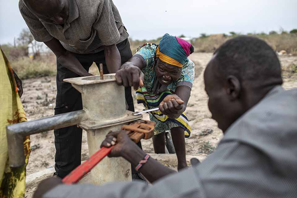 well pump mechanics dismantle a pump in South Sudan