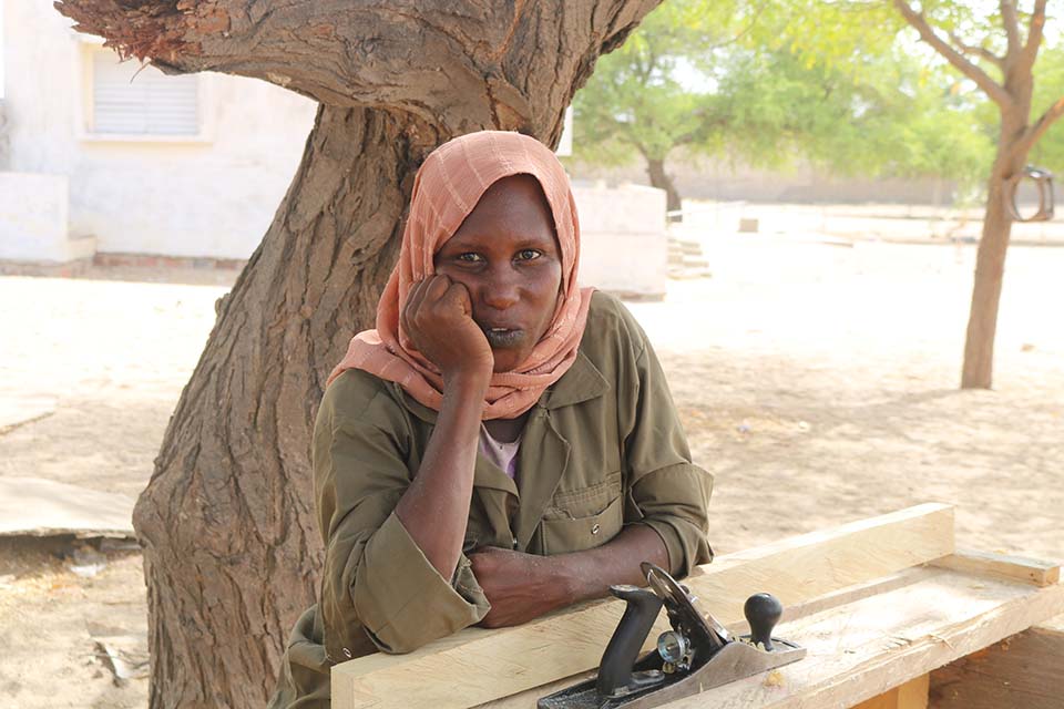 woman at workbench in Chad