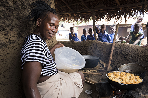 woman cooking in her shop in Sierra Leone