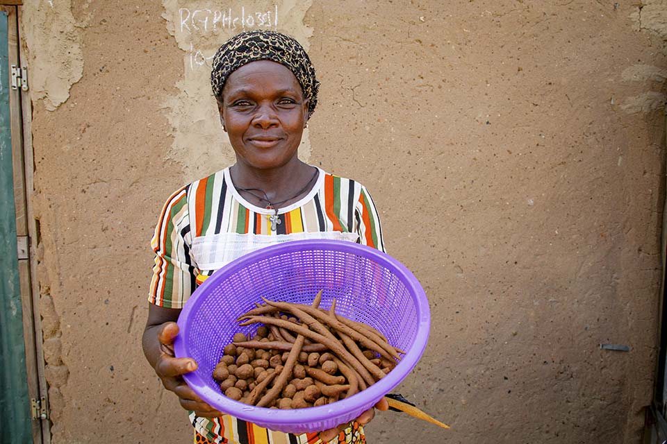 woman displays peanut snacks in Benin