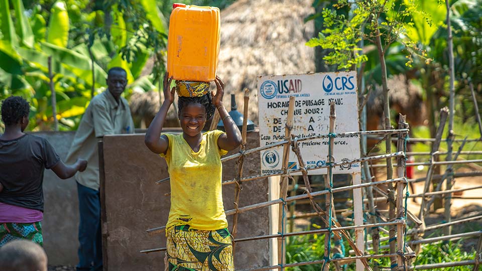 woman in DRC accesses clean water
