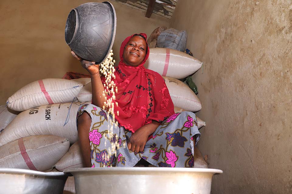 woman sifting corn in Benin
