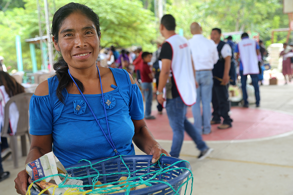 woman with chickens in Guatemala