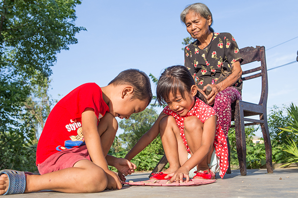 woman with grandchildren in Vietnam