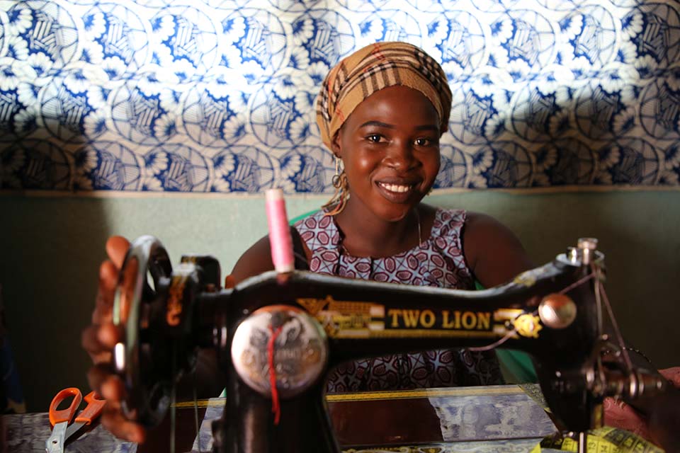 Cameroon woman at sewing machine