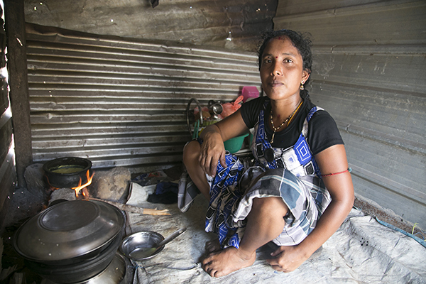 young mother in her kitchen in Sri Lanka