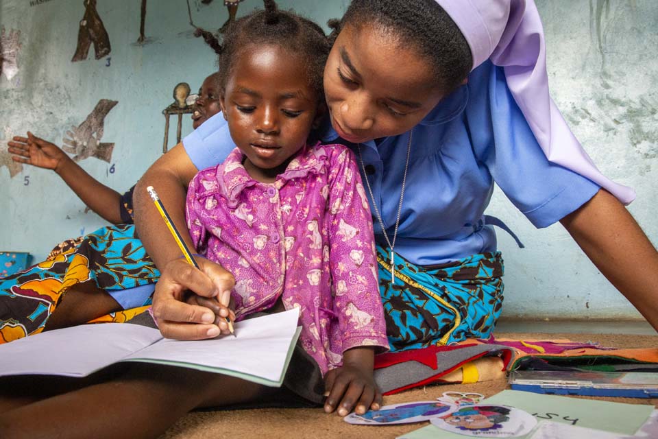 Zambia teacher and child