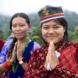 Woman from Nepal smiling and hands on prayer