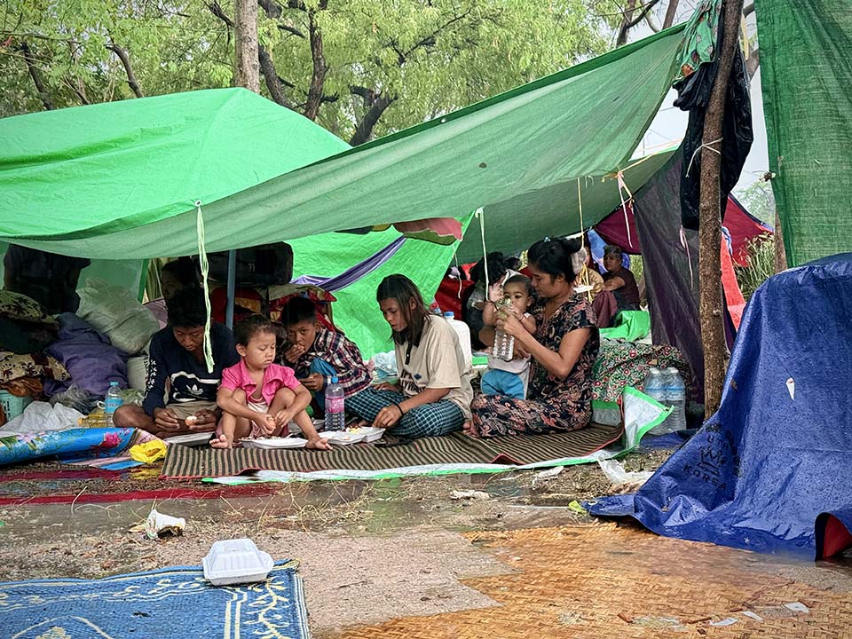 people sheltering under tarps in Myanmar