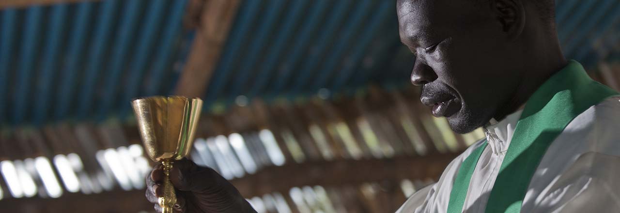 priest saying mass in South Sudan