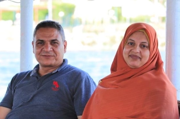 Egyptian couple sitting holding hands