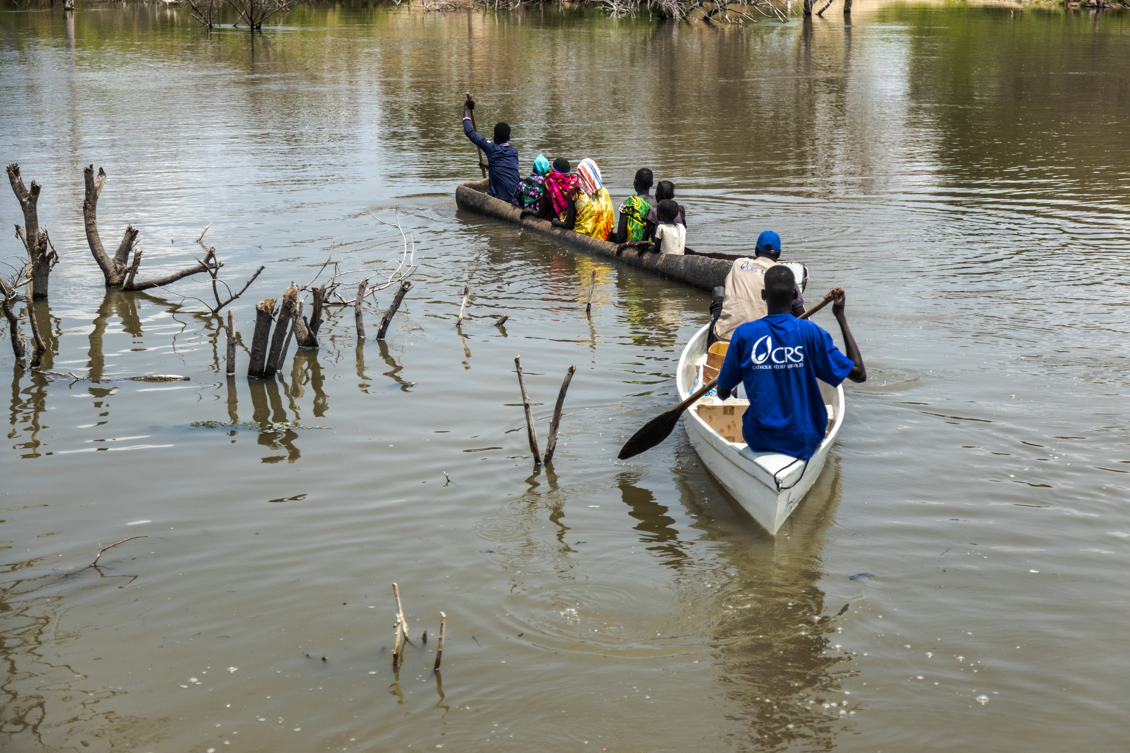 CRS Response Team delivering medicine on boats