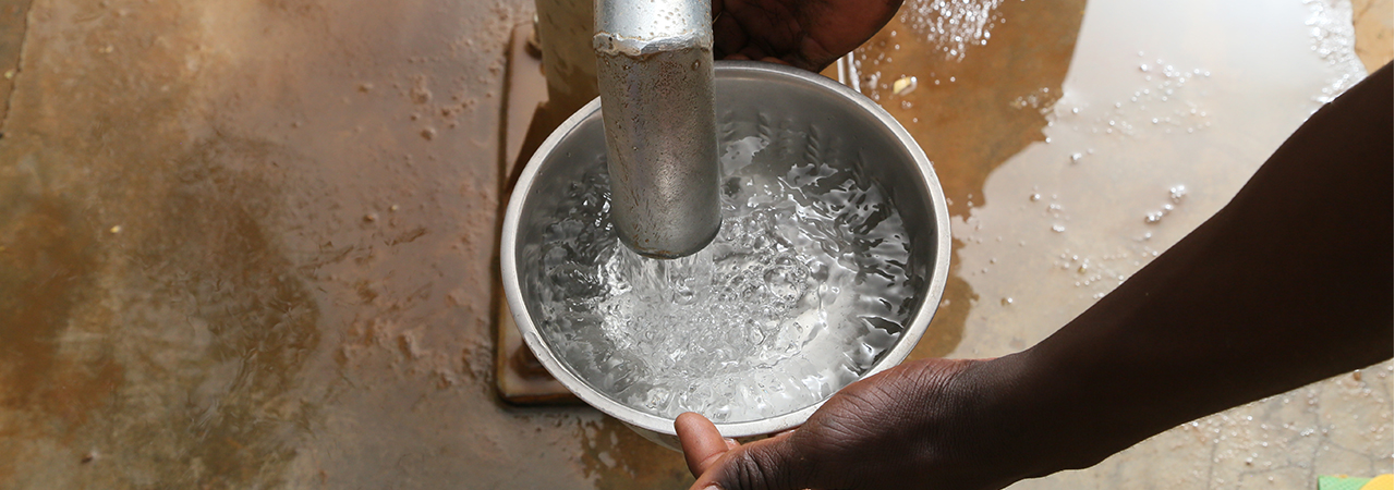 In Burkina Faso, community members use a community borehole