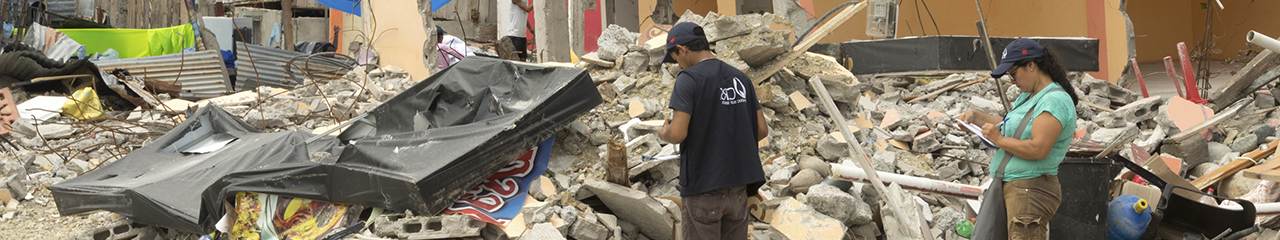 workers survey quake damage in Ecuador