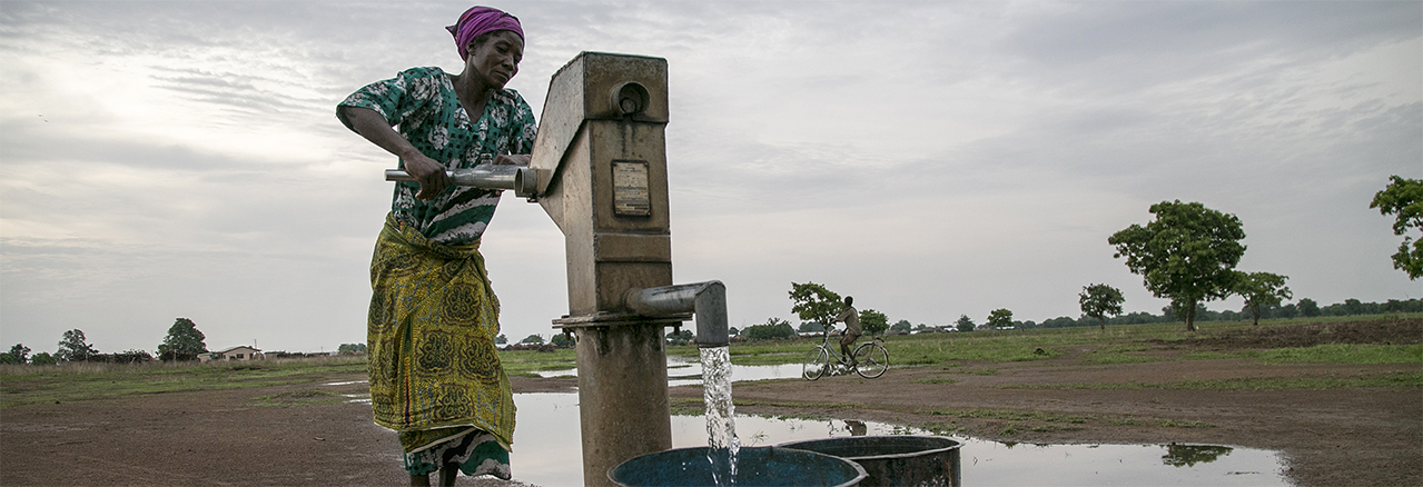 A woman in Jawani village utilizes a community borehole that was constructed with support from Catholic Relief Services in Ghana. 