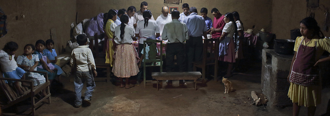 The Ramirez family prays in thanksgiving for God's provision.