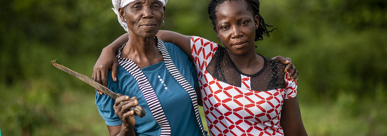 Photo by Michael Stulman/CRS Nora Tolee and Martha Yelekor farm cassava with their neighbors in Nimba County, Liberia.