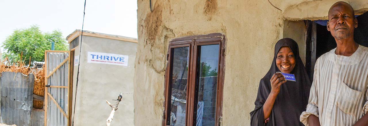 couple outside home in Nigeria