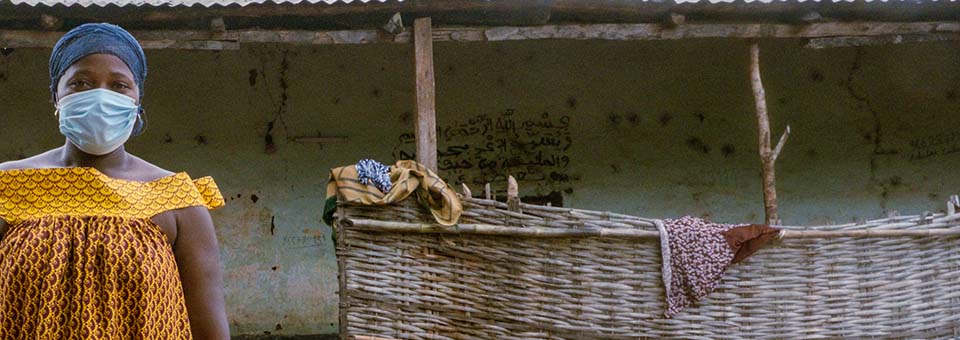 woman wearing mask facing camera in Guinea Bissau