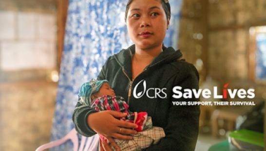 young mother green shirt holding newborn