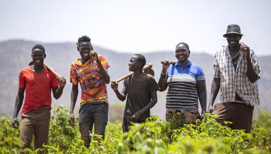 farmers laughing in a field