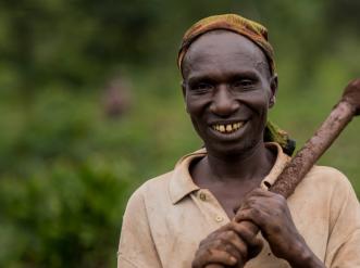 A man with a farm tool.