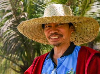 A man in a straw hat.