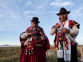 man and woman in indigenous clothing