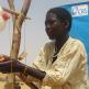 An easy-to-make hand washing system known as a "tippy tap" is demonstrated in Niger. Photo by Souradja Mahaman/CRS