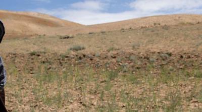 Afghan man with hills in background 