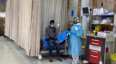 Healthcare worker helping patient