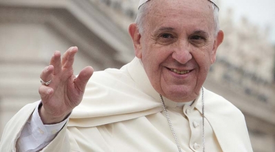 Pope Francis waves facing camera