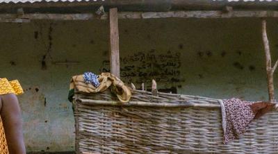 woman wearing mask facing camera in Guinea Bissau