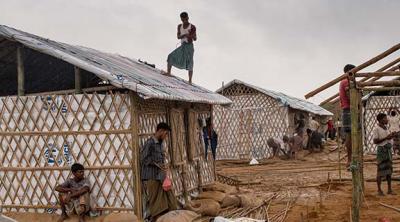 workers build shelters in a Bangladesh camp for Rohingya refugees