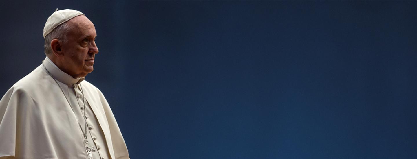 Pope Francis with a dark blue background
