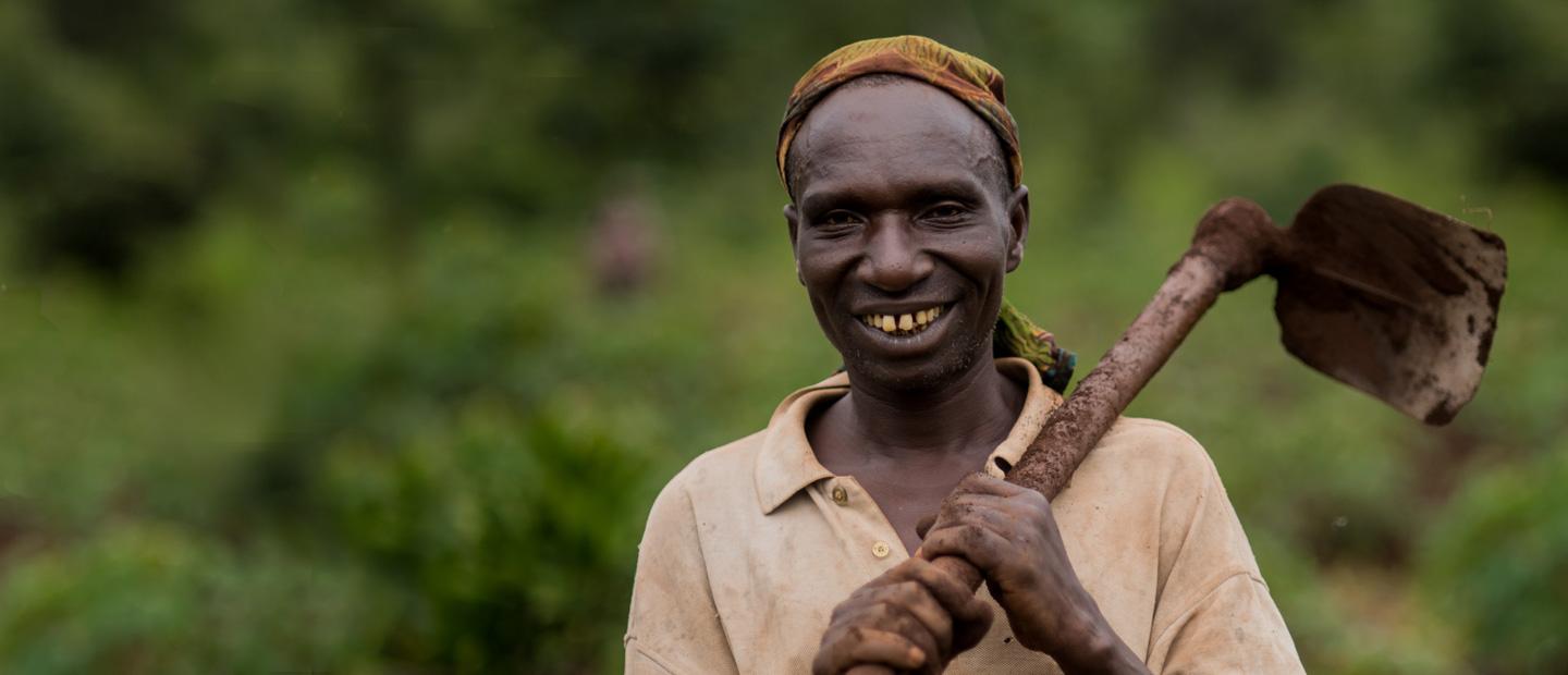 A man with a farm tool.