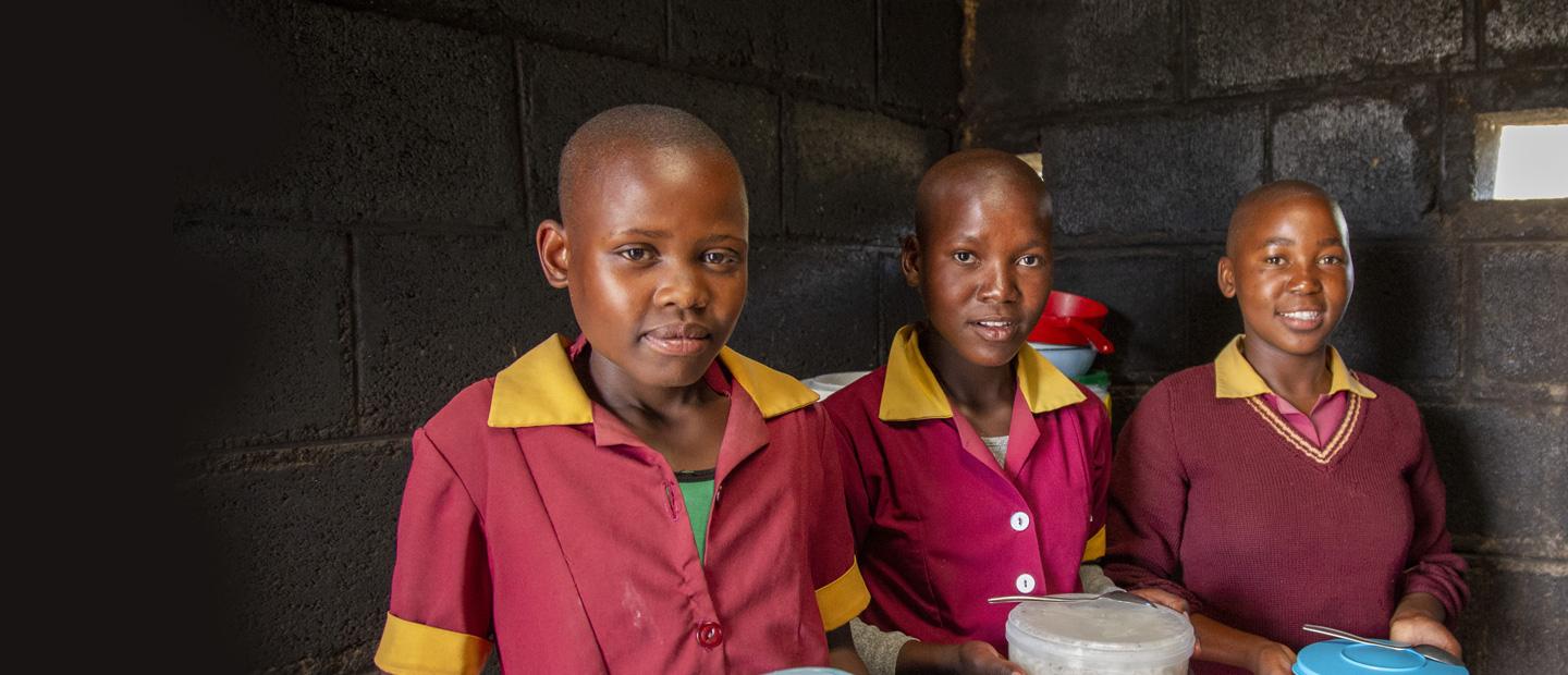 3 young girls in uniform.