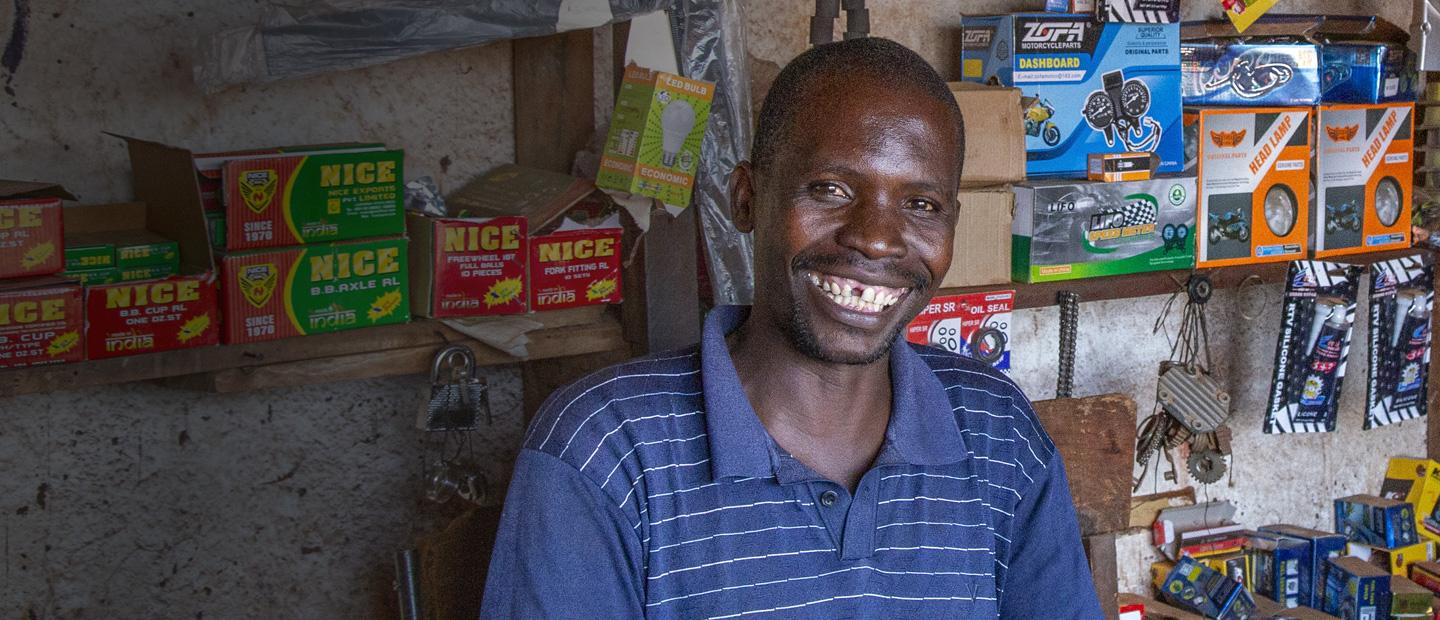 A man sitting inside a store.